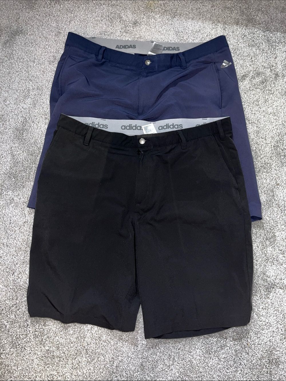 Two adidas 10 1/2” inseam Elastine/Polyester/climalite flat front golf shorts 40